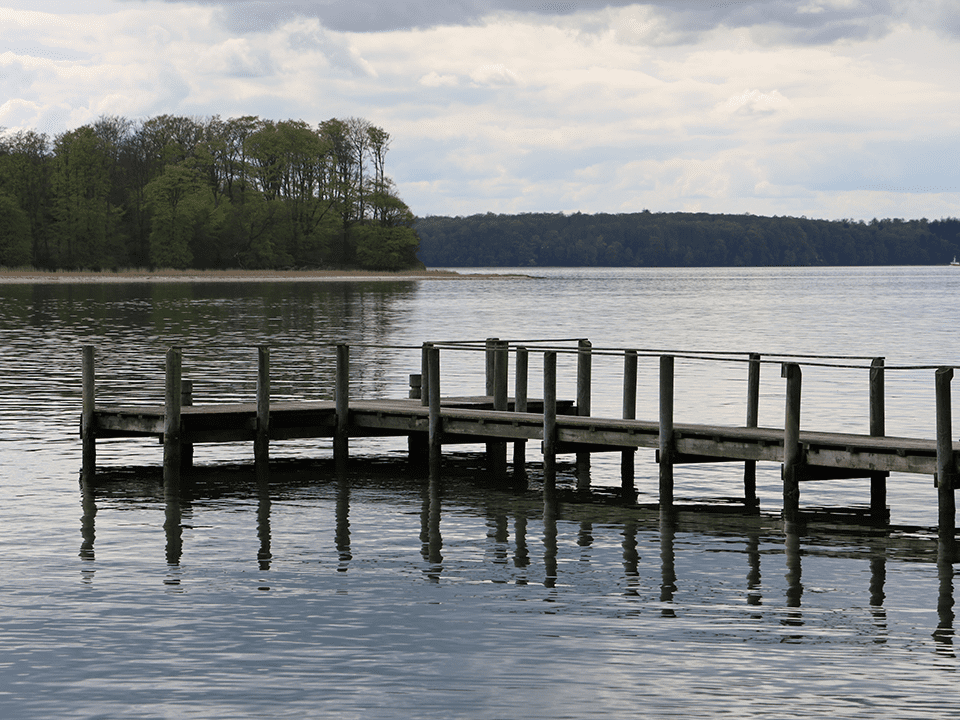 old-rusty-dock-by-lake-surrounded-by-beautiful-trees-middelfart-denmark